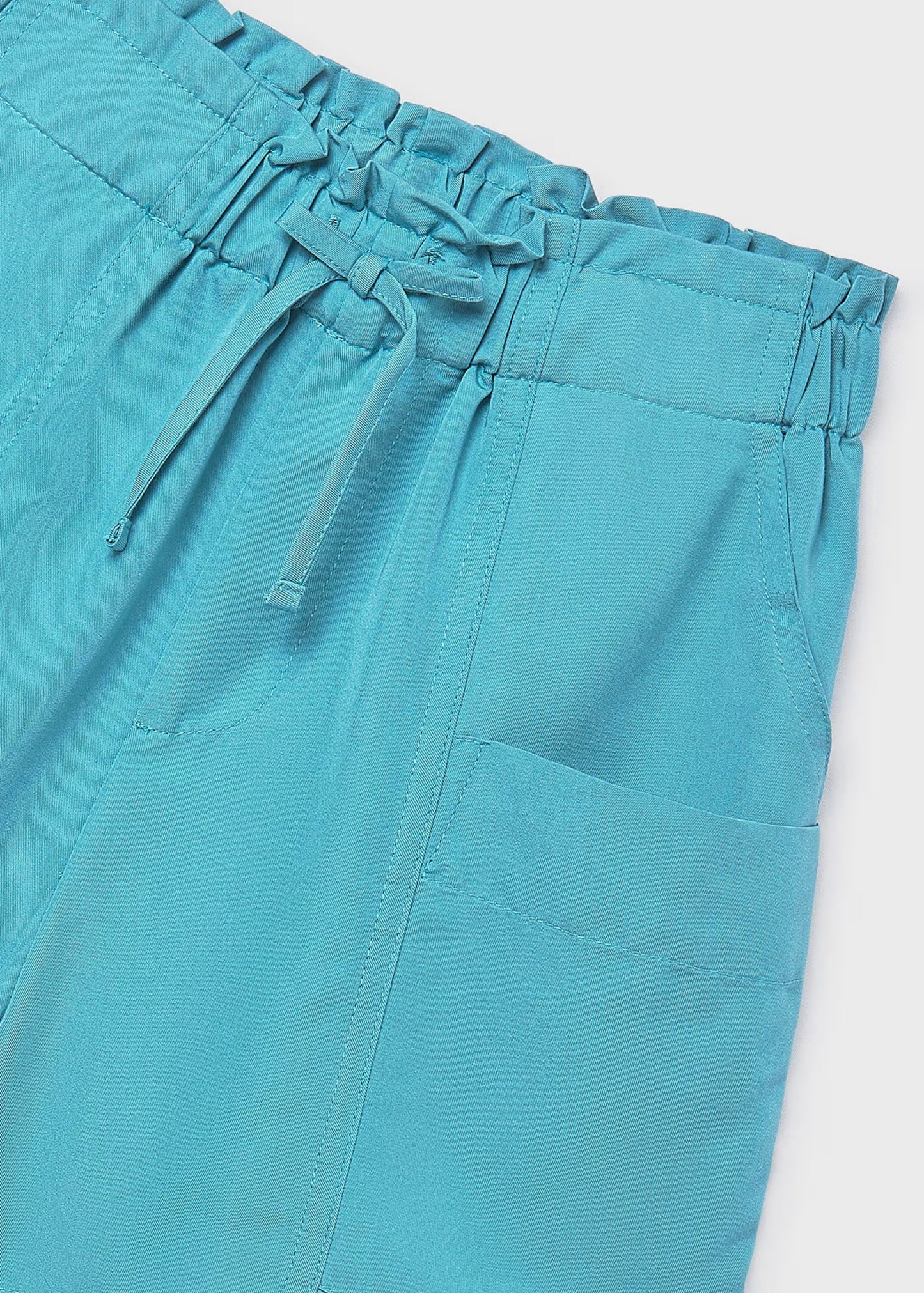 Pantalón corto bolsillos chica