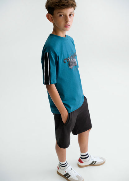 Conjunto bermuda y camiseta bota de fútbol chico