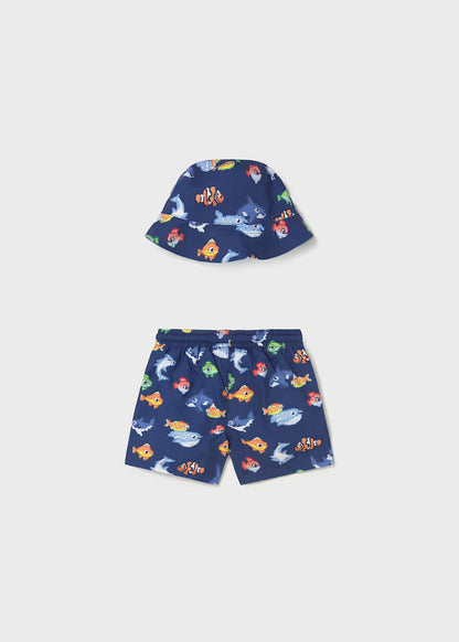 Conjunto bañador y gorro reversible protección solar bebé