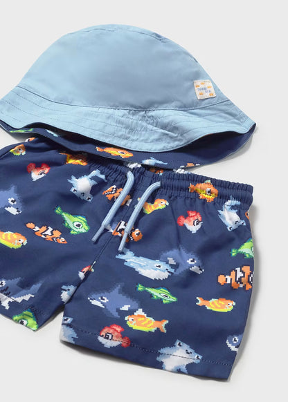 Conjunto bañador y gorro reversible protección solar bebé