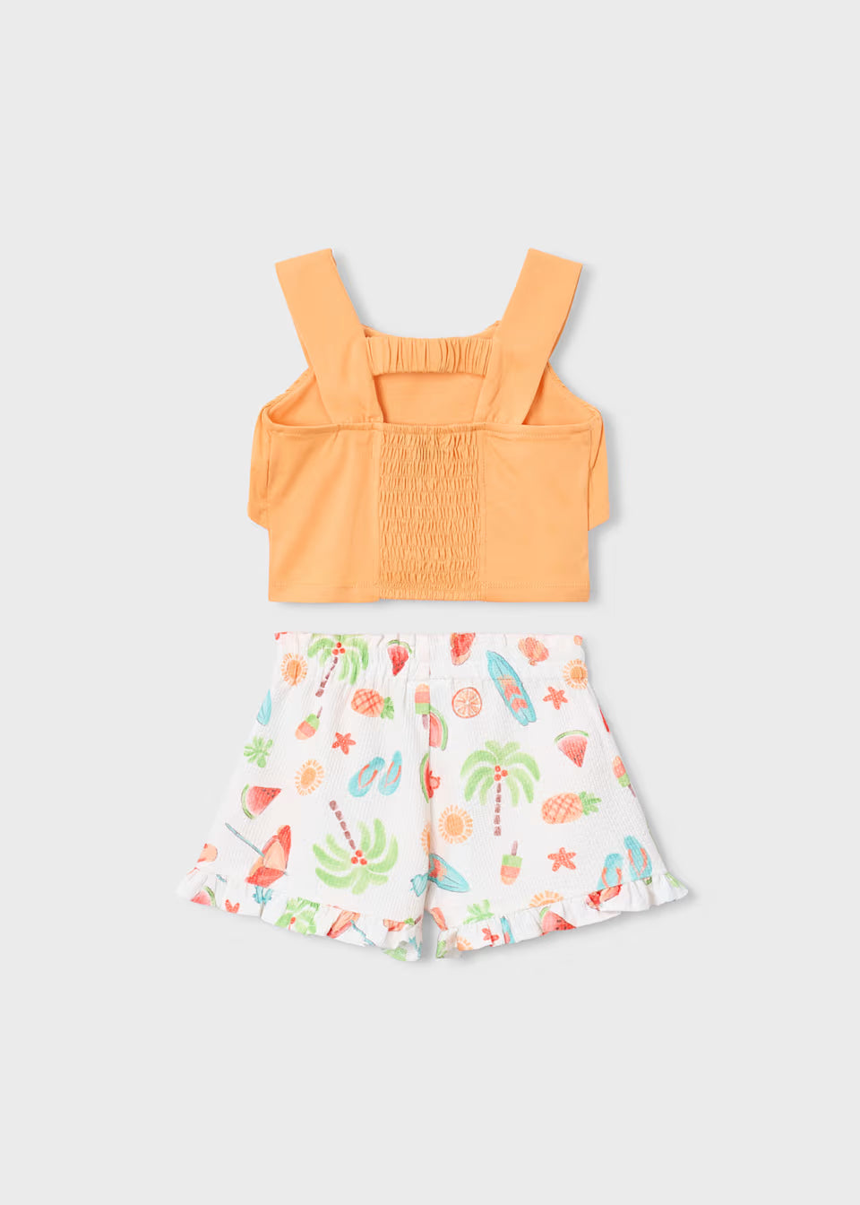 Conjunto pantalón corto estampado y top volantes niña