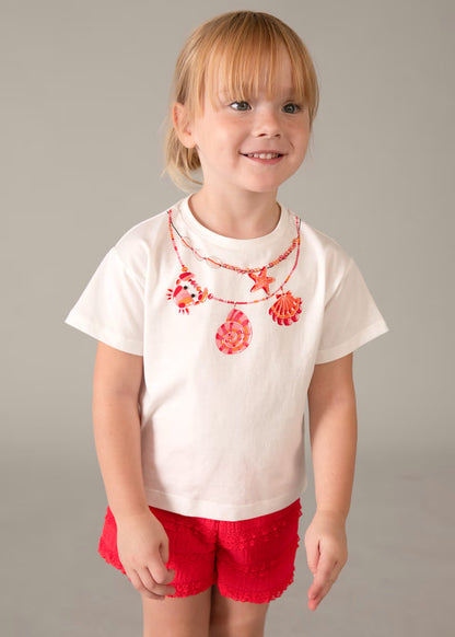 Conjunto pantalón corto volantes y camiseta estampada niña
