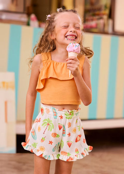 Conjunto pantalón corto estampado y top volantes niña